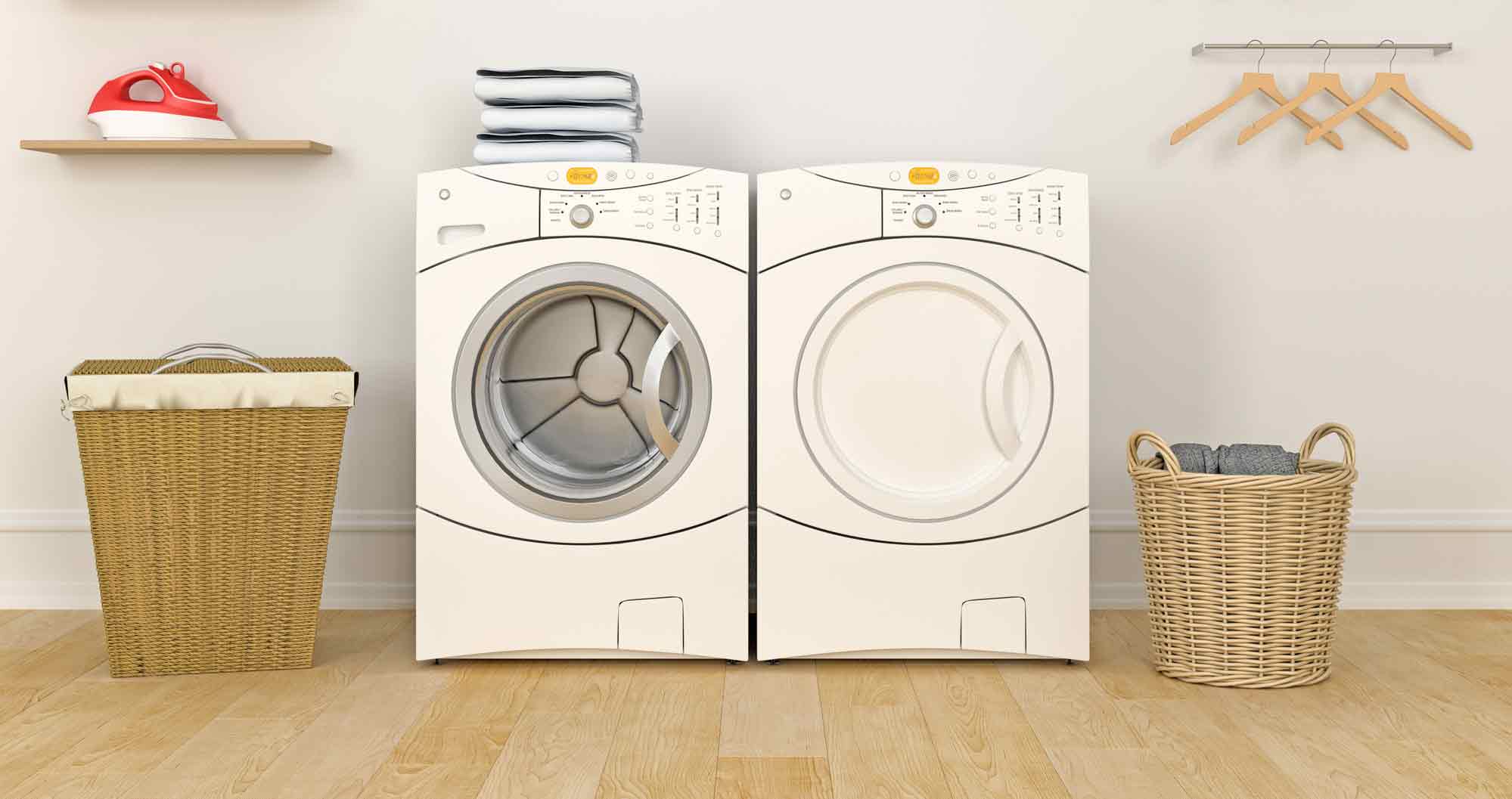 A washer and dryer in a room with wood floors.